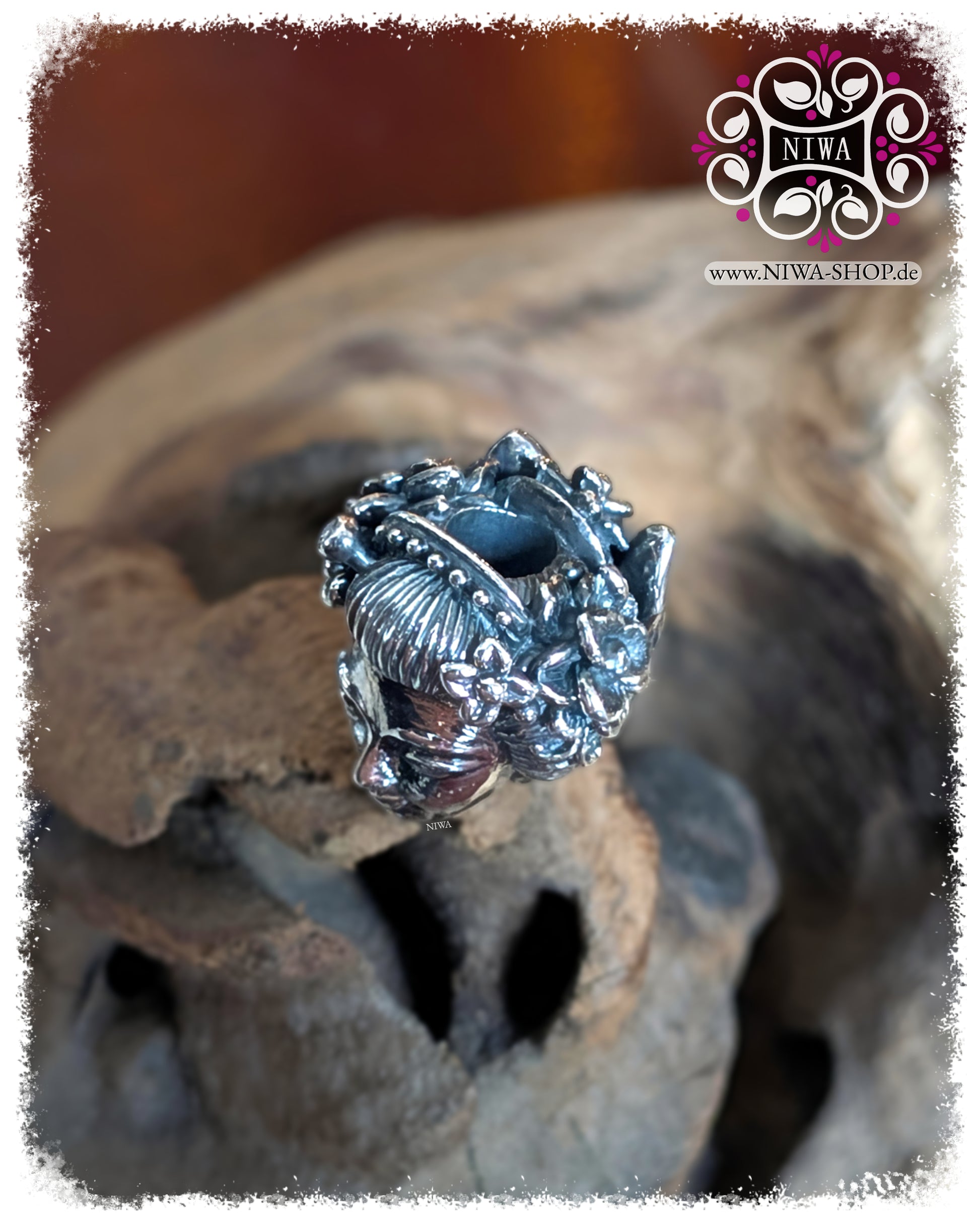 MAMA MALA, ASIA Collection, JAPAN series, GEISHA with KITSUNE mask charm made of solid 925 sterling silver, top view of hair ornaments and flower wreath, two white diamonds in hair accessories, wooden background.