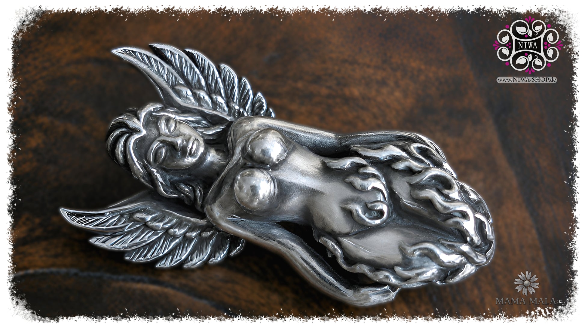 PHOENIXIA BORN of FIRE Lock by MAMA MALA made of 925 sterling silver in landscape format on dark wood, with finely crafted phoenix wings, stylized flames and a calm female figure.