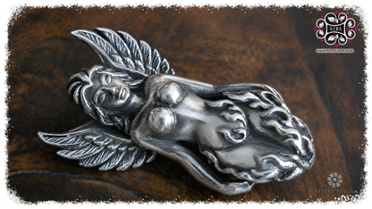 PHOENIXIA BORN of FIRE Lock by MAMA MALA made of 925 sterling silver in landscape format on dark wood, with finely crafted phoenix wings, stylized flames and a calm female figure.