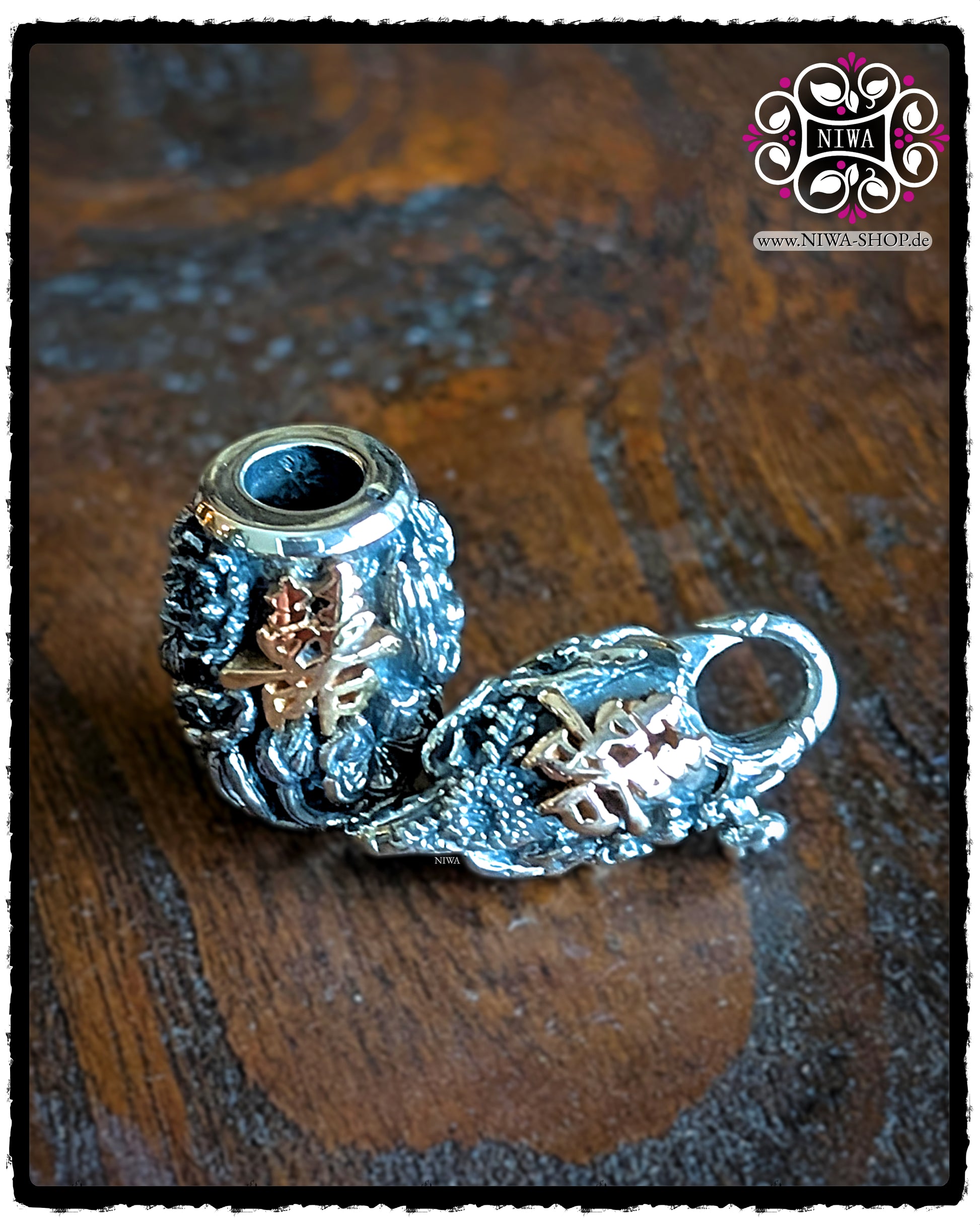 CHINESE DOUBLE HAPPINESS BarrelCharm and matching CHINESE DOUBLE HAPPINESS Lock made of 925 STERLING SILVER with 18K ROSE GOLD characters, decoratively arranged together on a dark wooden surface.