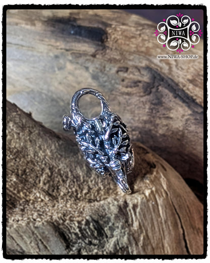 CHINESE DOUBLE HAPPINESS Lock back view made of 925 STERLING SILVER with detailed floral relief, lying on a wooden surface.