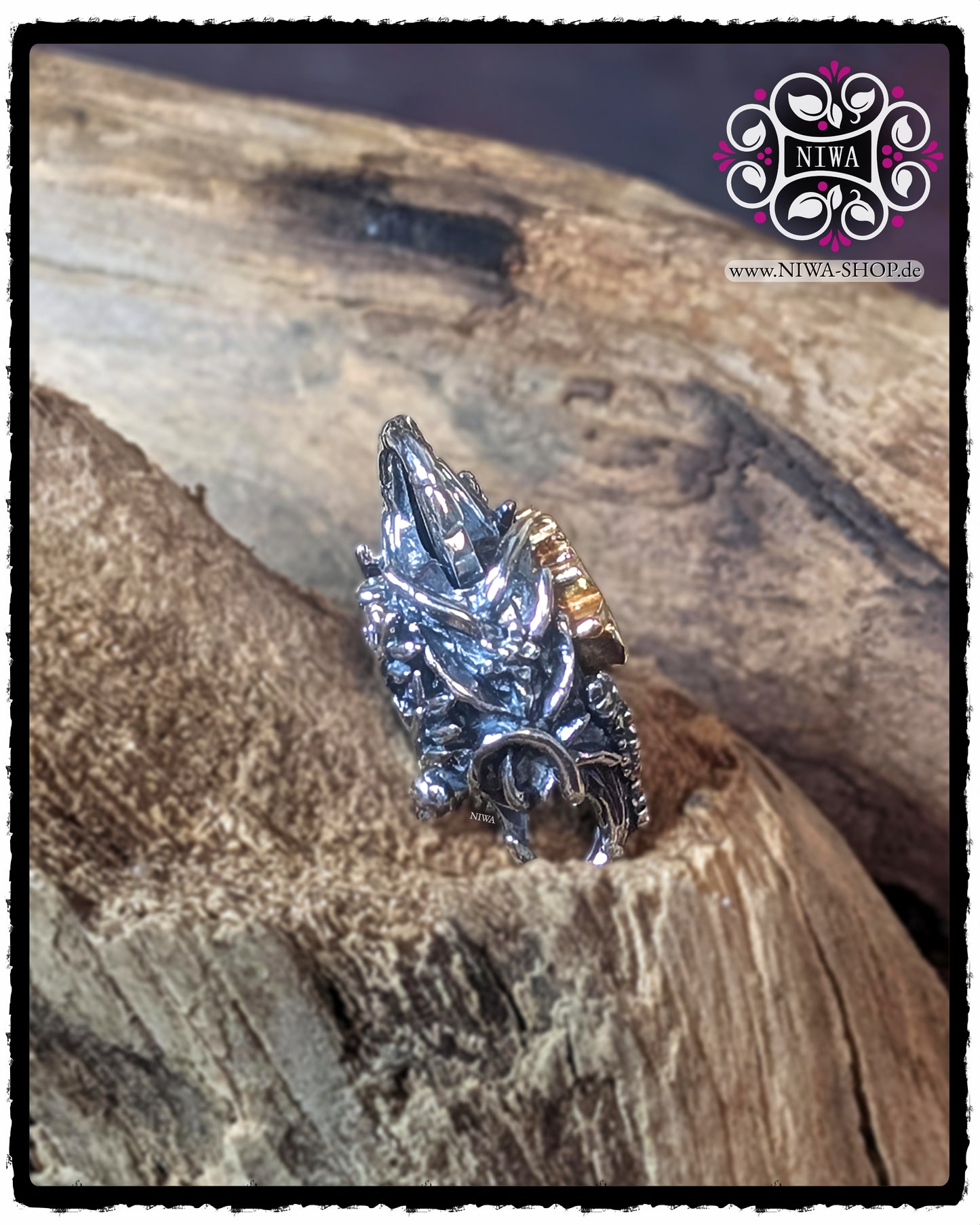 CHINESE DOUBLE HAPPINESS Lock oblique side view, focus on locking mechanism and three-dimensional LOTUS relief made of 925 STERLING SILVER, against a natural wooden background.