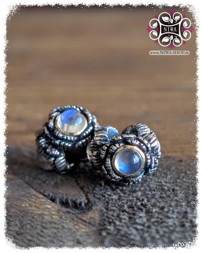 BABY PEONY BLOOM MiniCharm Cabochon Edition with blue moonstone, two MiniCharms on a wooden surface in a staggered view by NIWABeads