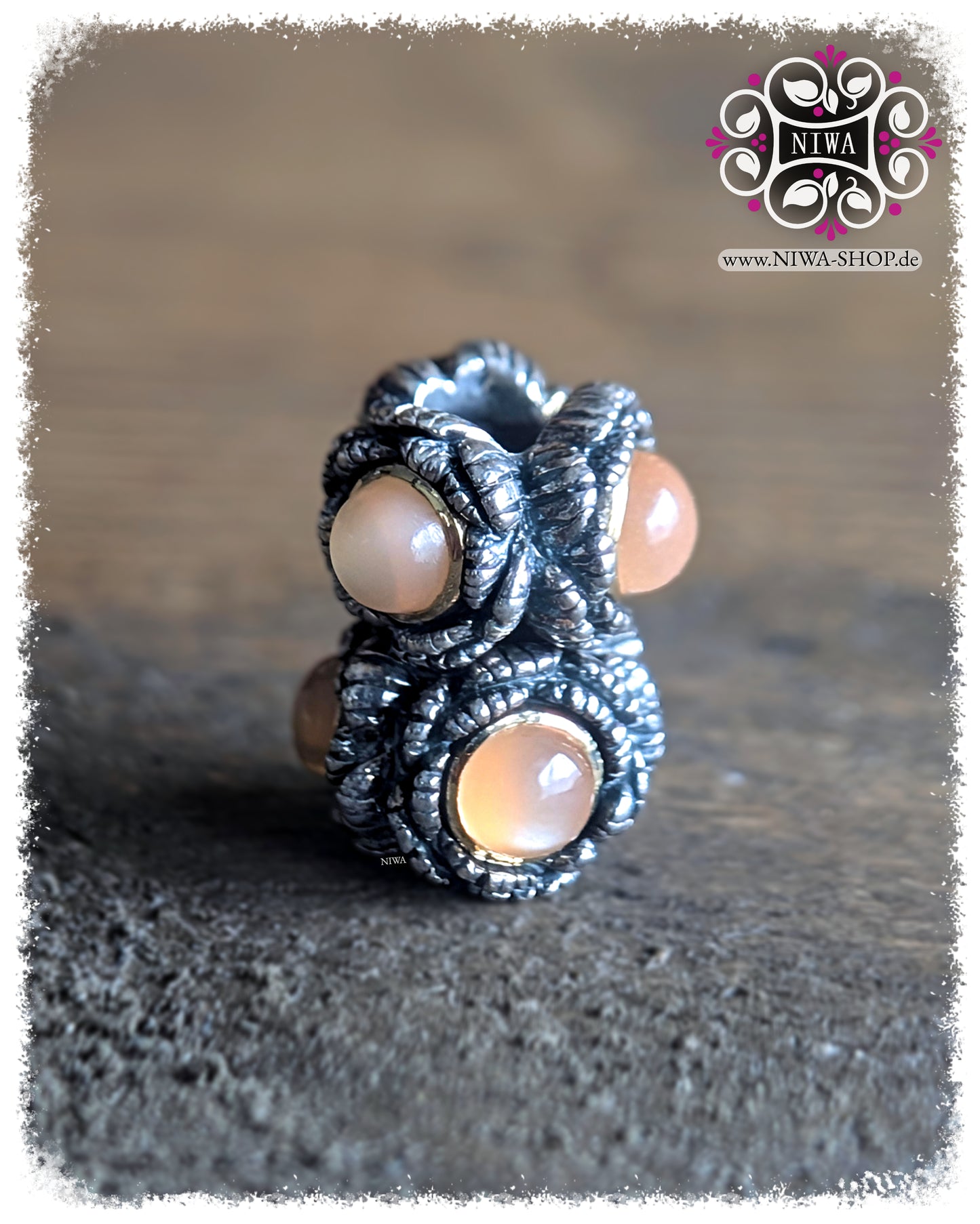 BABY PEONY BLOOM MiniCharm Cabochon Edition with Peach Moonstone, two MiniCharms in a staggered view on a wooden surface by NIWABeads