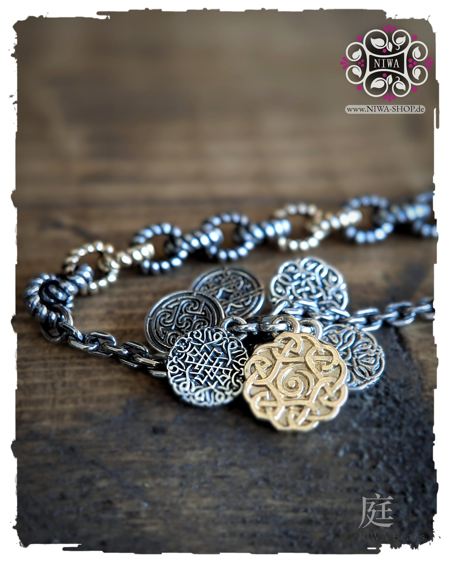 INFINITY COINS DangleSpacer from NIWABeads in TwoTone yellow gold with ornamental silver coins, large middle coin in 14K yellow gold and Half Half bracelet FEBURA in TwoTone yellow gold in the background.